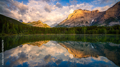 Mountains reflecting in calm lake at sunset