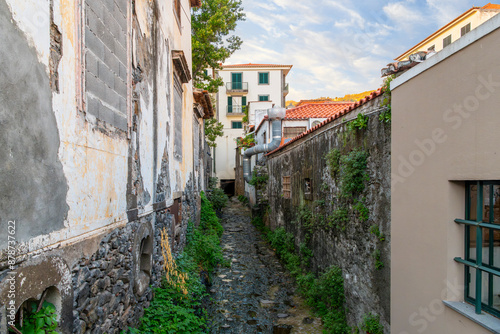 A small stream that leads to the sea providing stormwater runoff from the mountain top in the Zona Velha old town district of Funchal, Portugal, Madeira, in the Canary Islands.