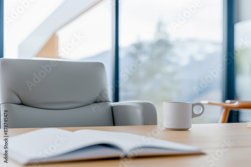 Designer's desk with empty open notepad and cup of coffee, selective focus, interior design concept © Ed