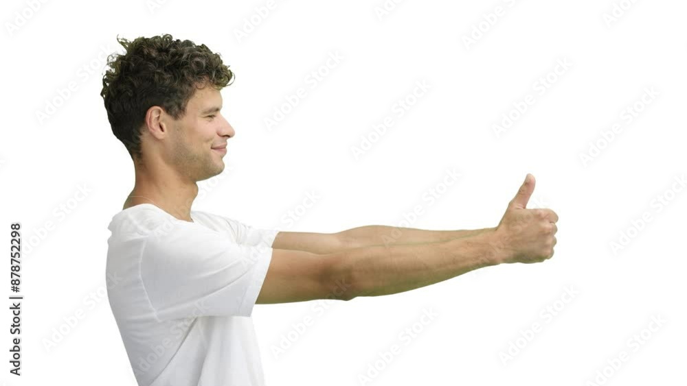 A man in a white T-shirt, on a white background, close-up, shows his thumbs up A man in a white T-shirt, on a white background, close-up, shows his thumbs up