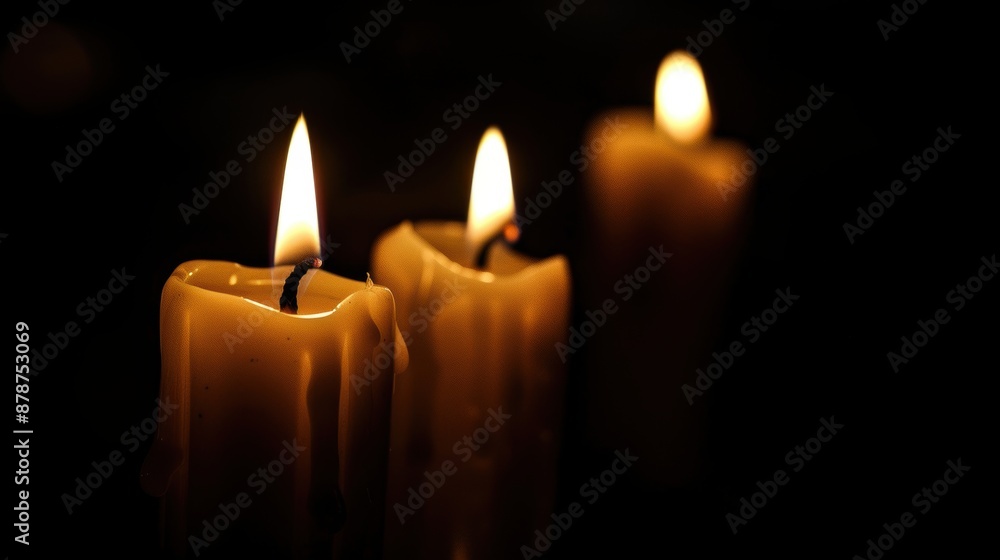 Three burning candles in a dark room Three burning candles in a dark room