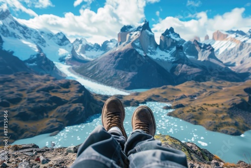 Wallpaper Mural Legs of traveler sitting on a high mountain top in travel. Freedom concept. Torontodigital.ca