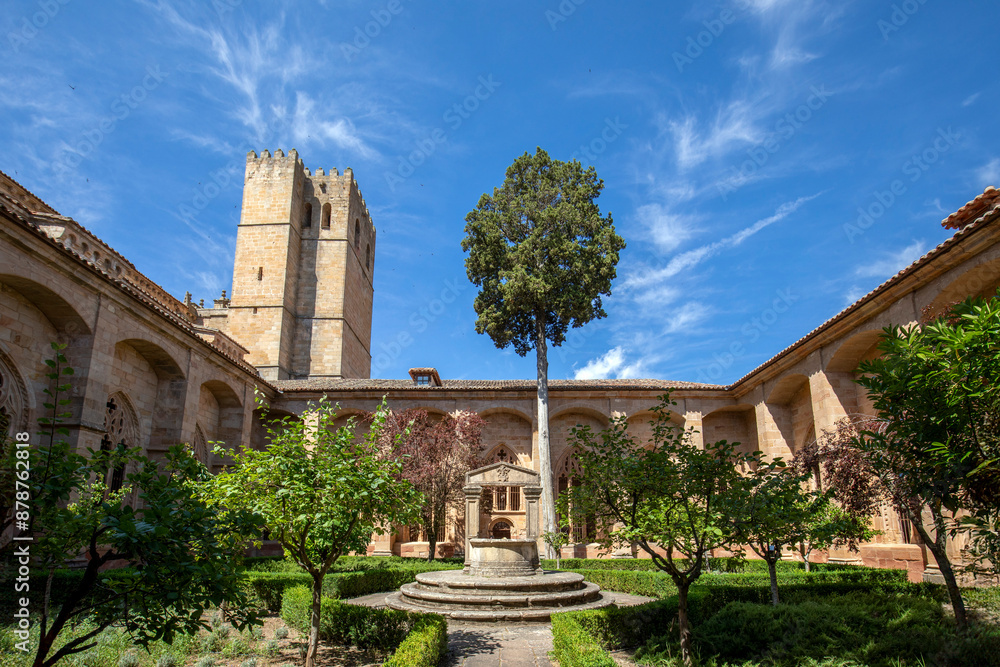 Obraz premium Interior of the medieval landscaped cloister of Sigüenza Cathedral, Guadalajara, Spain, with one of the towers in the background