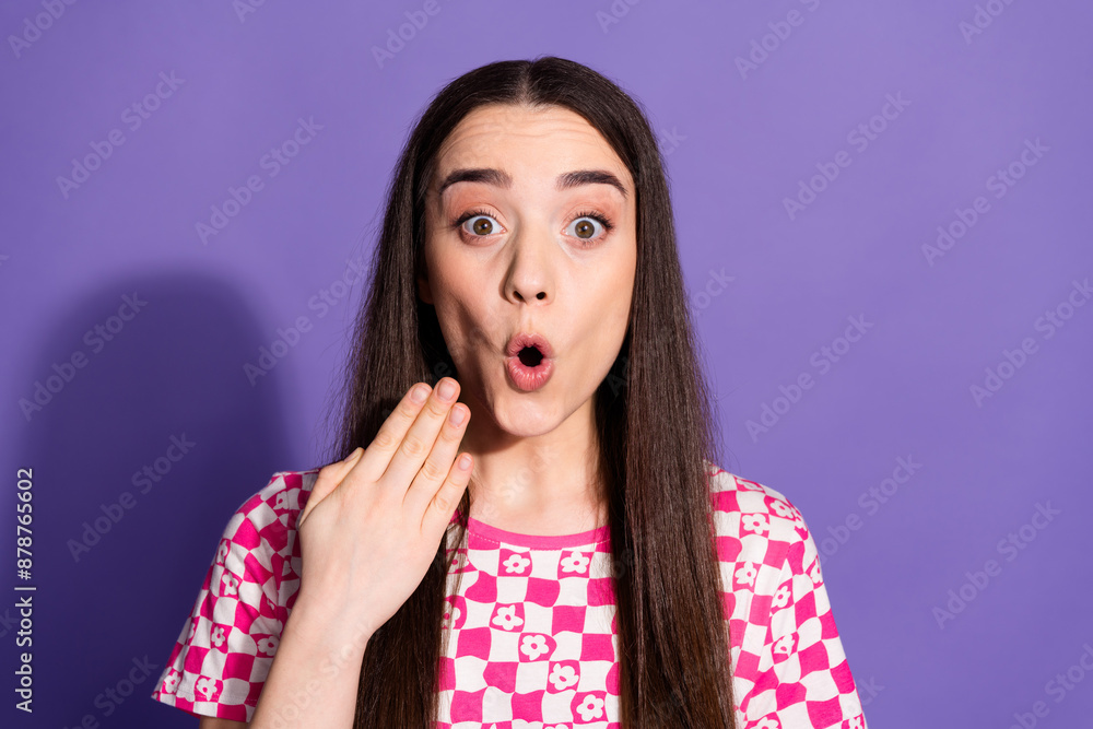 Portrait of nice young woman stare empty space wear checkered t-shirt isolated on violet color background Portrait of nice young woman stare empty space wear checkered t-shirt isolated on violet color background