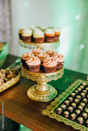 cupcakes on dessert table at wedding reception