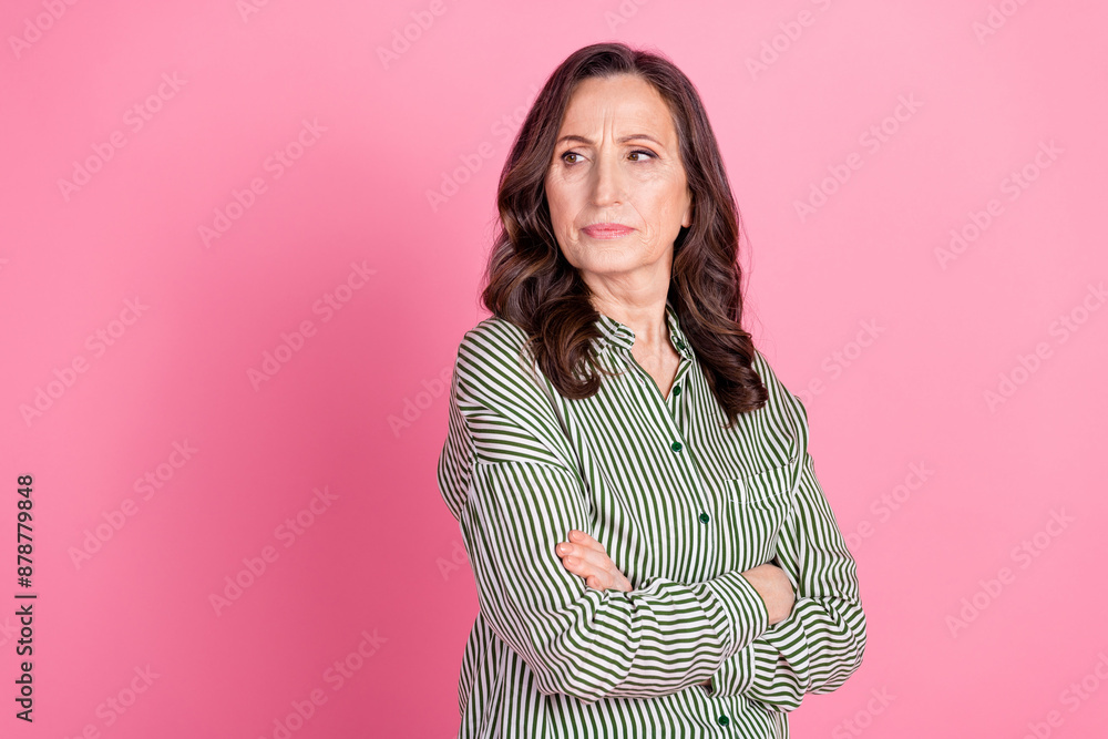 Fototapeta premium Photo of adorable lovely woman wear striped shirt arms crossed looking empty space isolated pink color background