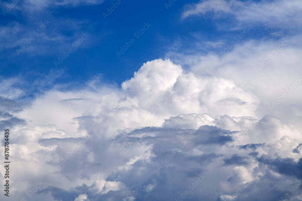 White clouds against the blue sky background in sunny cloudy summer day White clouds against the blue sky background in sunny cloudy summer day
