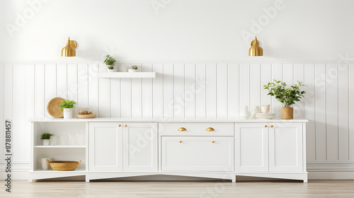 White cabinets, gold accents, and green plants create a minimalist and elegant kitchen design. 
