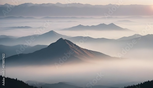 mountain layers and sunrise view in cold and foggy weather.