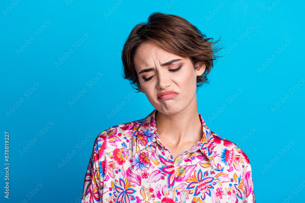 Photo of gloomy sad girl wear trendy clothes negative emotion feeling bad unwell isolated on blue color background Photo of gloomy sad girl wear trendy clothes negative emotion feeling bad unwell isolated on blue color background
