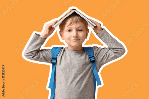 Little schoolboy with book ...