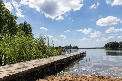 Pomost na plaży w słoneczny dzień Jezioro Lubie Zachodniopomorskie photo