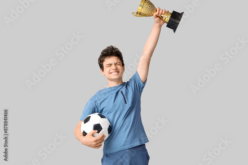 Teenage boy with soccer bal...