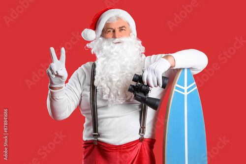 Santa Claus with surfboard ...