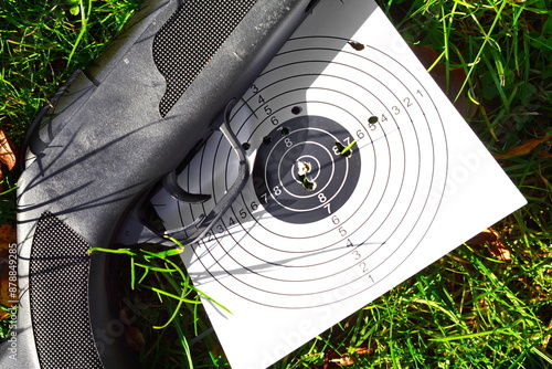 air rifle and the target are on the ground photo