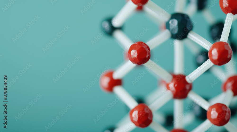 Obraz premium Abstract molecular structure with red and black spheres connected by white rods, showcasing a scientific and modern concept on a blue background.