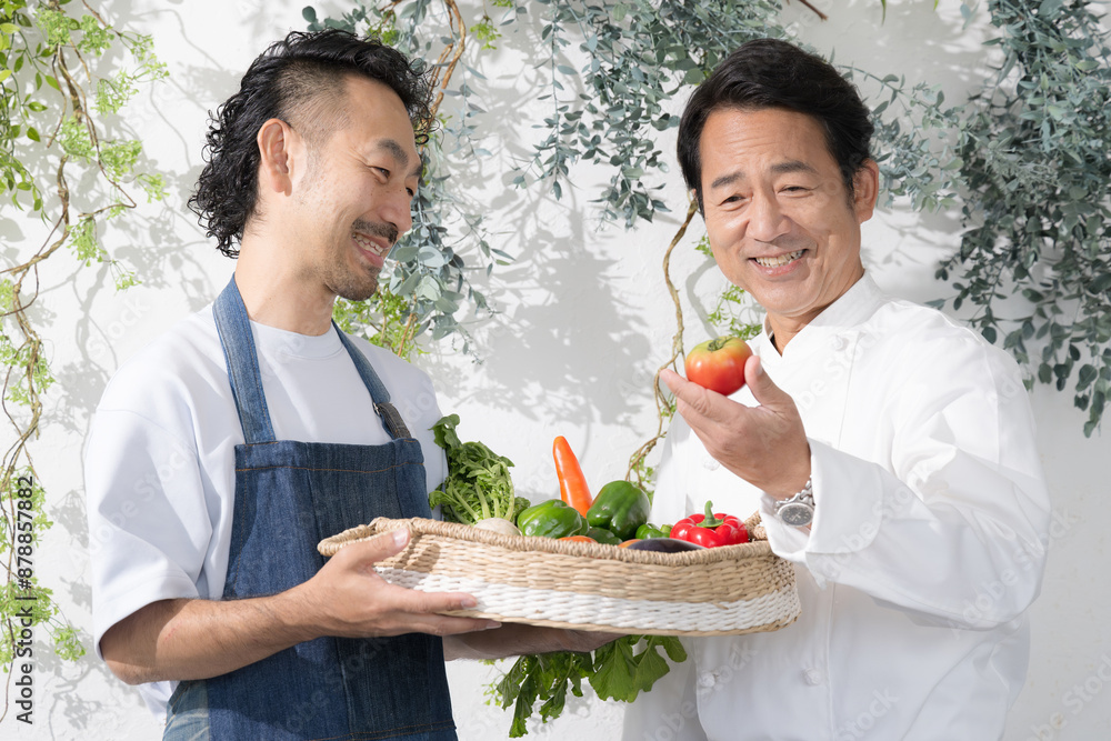 A chef checking vegetables delivered from a farmer A cook in a cook's coat who contracts or deals directly with the farmer A chef checking vegetables delivered from a farmer A cook in a cook's coat who contracts or deals directly with the farmer