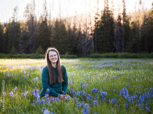 Young Woman Sitting In Field of Purple Flowers photo