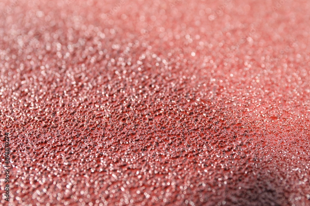 Texture of coarse sandpaper as background, closeup Texture of coarse sandpaper as background, closeup