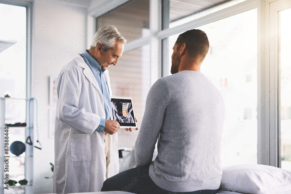 Doctor, man and patient with tablet for xray consultation of spine anatomy, inflammation and surgery planning. Senior radiologist, digital app and happy with health assessment and medical analysis Doctor, man and patient with tablet for xray consultation of spine anatomy, inflammation and surgery planning. Senior radiologist, digital app and happy with health assessment and medical analysis