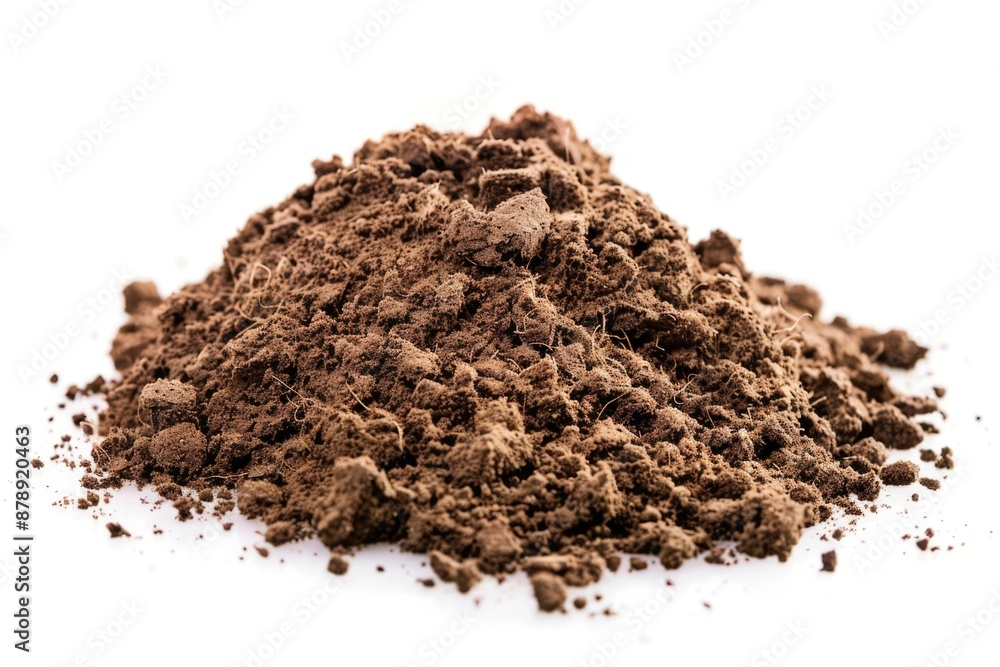 A small pile of dirty soil on a clean, white surface A small pile of dirty soil on a clean, white surface