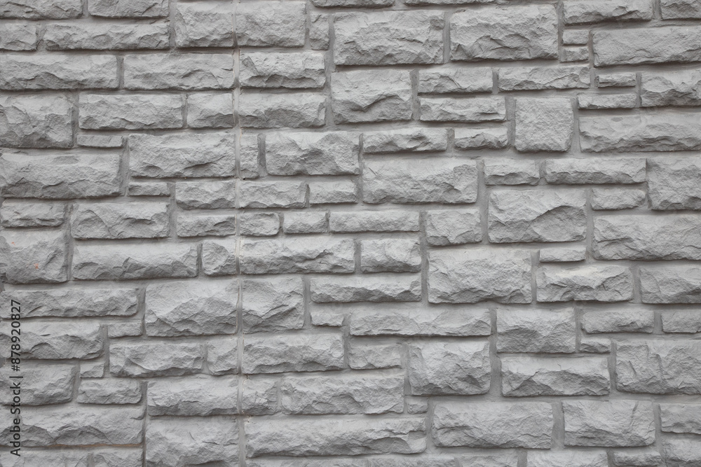 Fototapeta premium Gray stone wall full frame background.