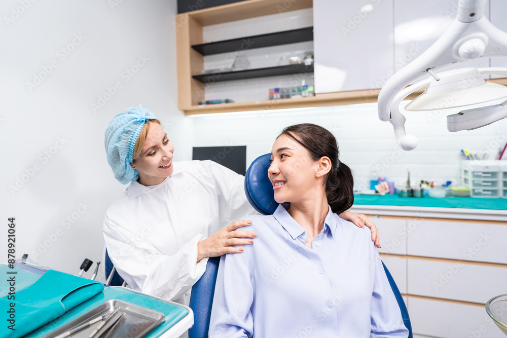 Fototapeta premium Caucasian dentist examine tooth for young girl at dental health clinic. 