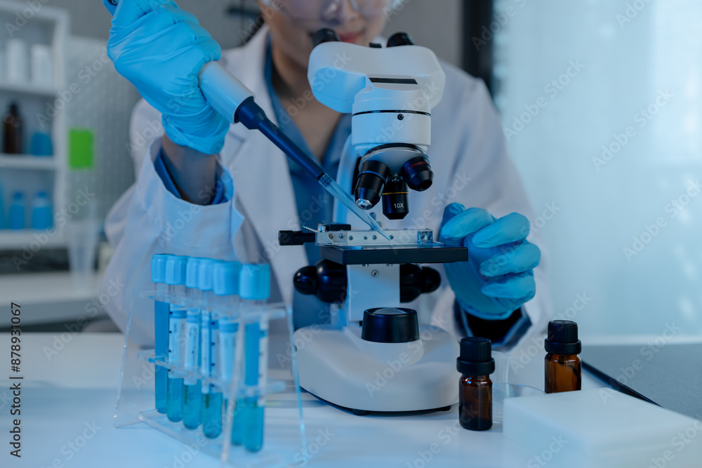 scientist is using microscope in laboratory, chemical researcher works in chemistry with concentration, chemist is conducting a science experiment using a microscope to test experimental substances scientist is using microscope in laboratory, chemical researcher works in chemistry with concentration, chemist is conducting a science experiment using a microscope to test experimental substances