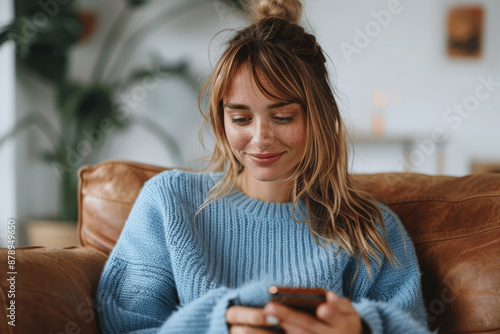 Young Professional Woman Texting on Smartphone in Minimalistic Living Room
