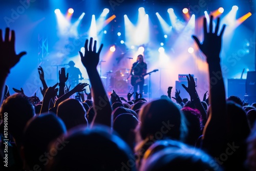 Crowd of Fans at a Concert with Bright Stage Lights