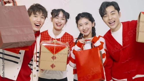 Happy young friends shopping for Chinese New Year