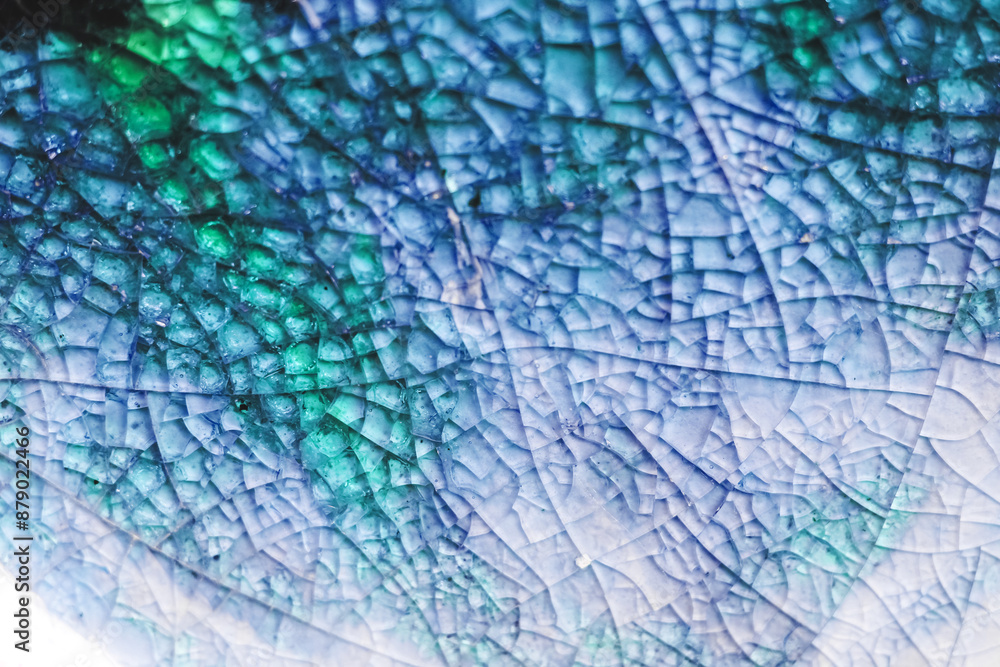 Fototapeta premium Texture of azure broken glass, close-up