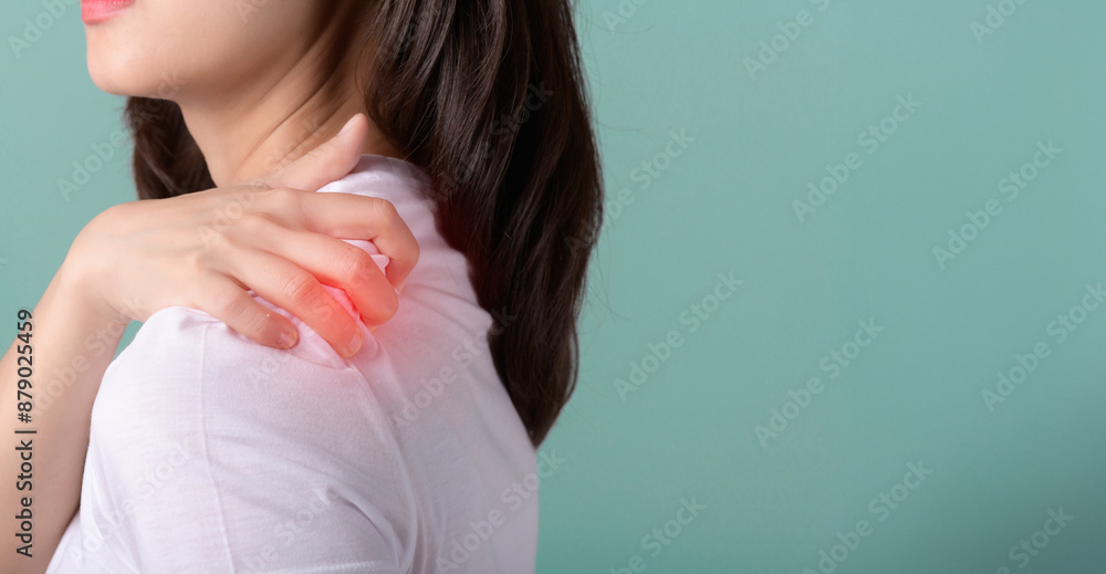 office syndrome. Pain body muscles stiff problem, suffer asian young woman, girl face painful, hand holding neck ache from work hand holding massaging rubbing shoulder hurt, sore against green wall office syndrome. Pain body muscles stiff problem, suffer asian young woman, girl face painful, hand holding neck ache from work hand holding massaging rubbing shoulder hurt, sore against green wall