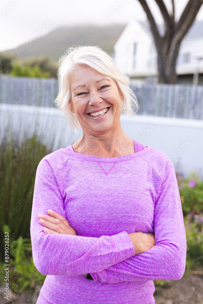 Vertical portrait of happy senior caucasian woman with white hair smiling outdoors Vertical portrait of happy senior caucasian woman with white hair smiling outdoors