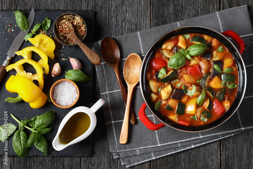 Canvas-taulu hearty italian vegetable stew in red pot, top view