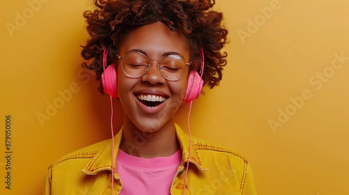 Smiling Woman Listening to Music with Headphones © MUCHIB