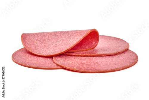 Thin salami sausage slices, isolated on white background. photo