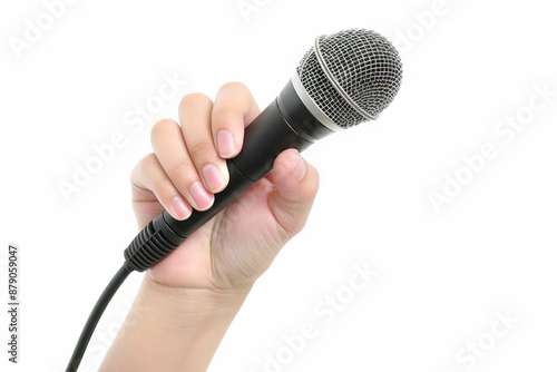 A hand holds a black microphone against a white background.