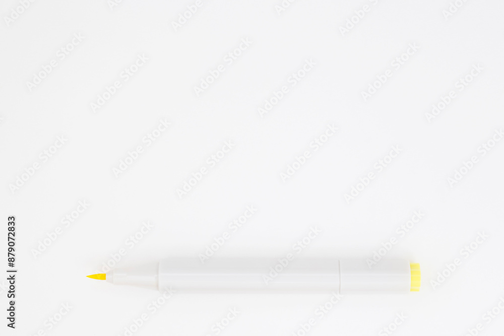 opened yellow marker laying on blank white page opened yellow marker laying on blank white page