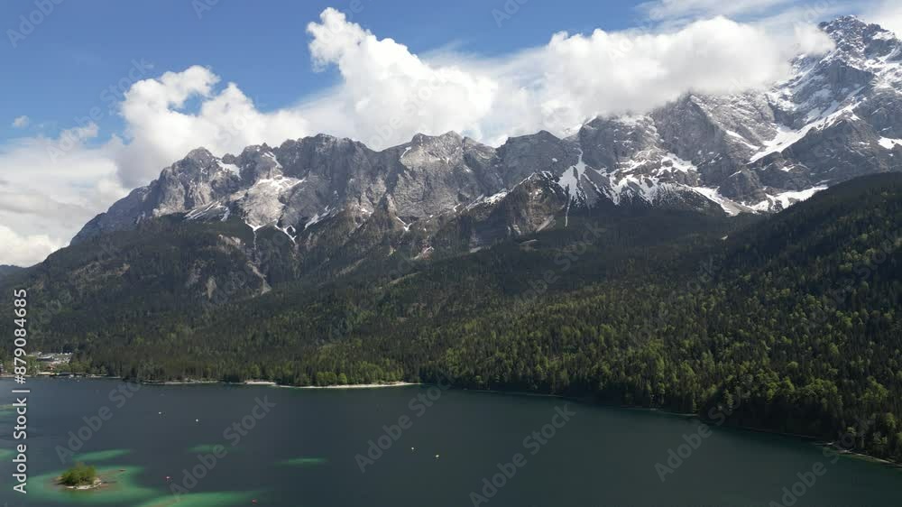 Eibsee Bayern Germany aerial view winter above and summer down below on the lake Eibsee Bayern Germany aerial view winter above and summer down below on the lake