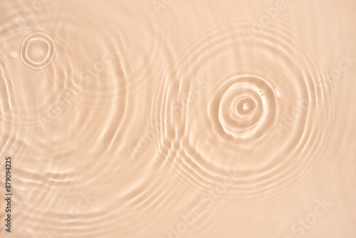 water texture ripples wave clean transparent water abstract background in beige color