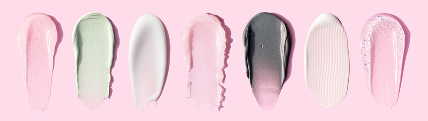 banner creamy texture of cosmetic samples on pink background