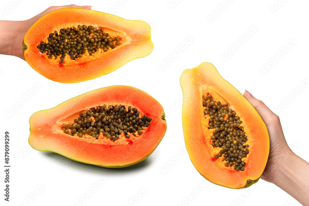 Papaya fruit isolated on a white background in woman hands. Half papaya. Papaya fruit isolated on a white background in woman hands. Half papaya.