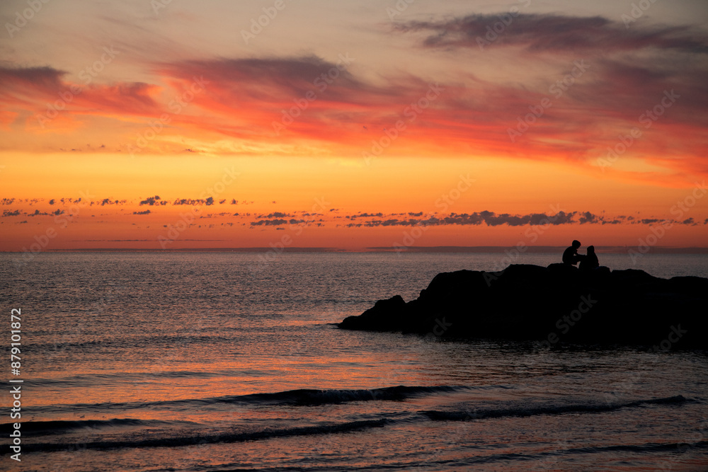 Scenic coastal sunset with colorful sky reflection Scenic coastal sunset with colorful sky reflection