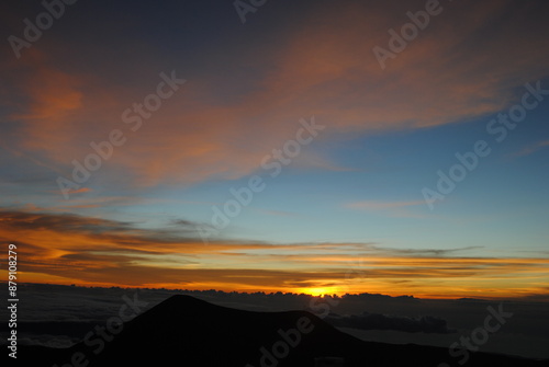 sunset over the clouds in the mountains 