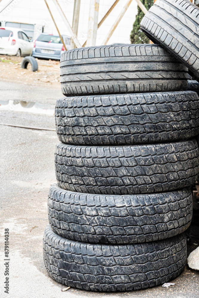 Stack of Used Tires on Pavement Stack of Used Tires on Pavement