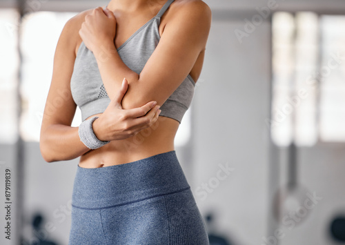 Photography Fitness, elbow pain and hands of woman with injury from workout, training and exercise accident in gym