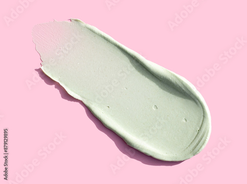 cream texture care cosmetics smear mask peeling green color on pink background skin care concept