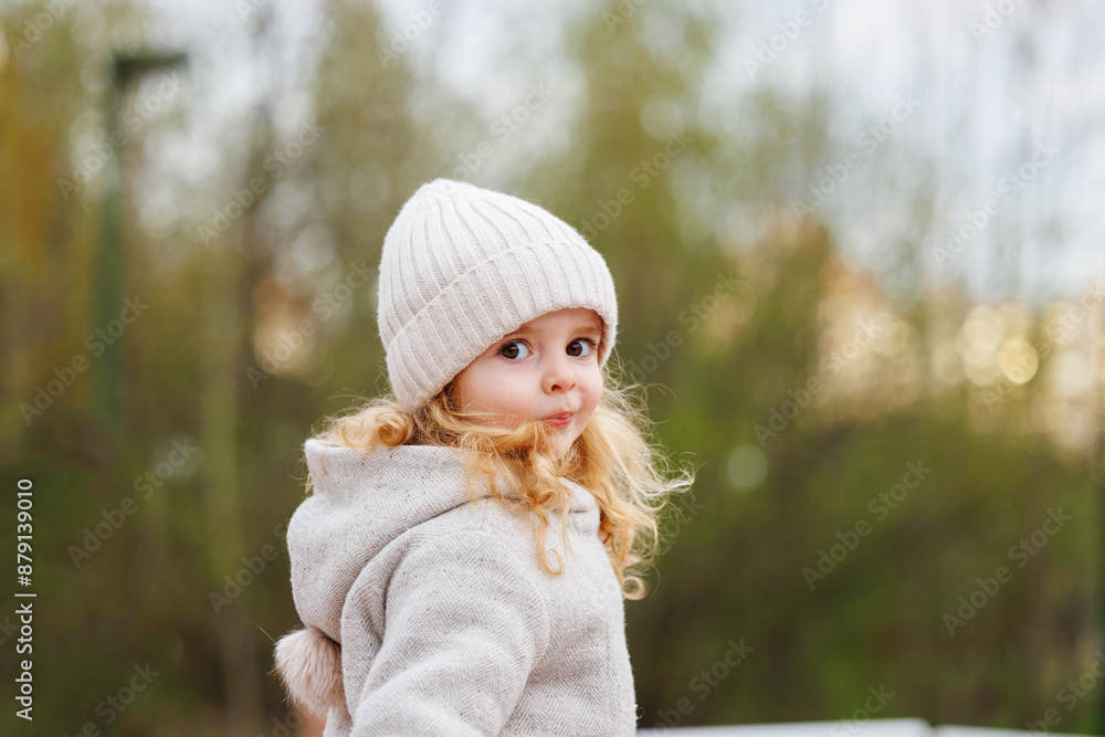 Portrait of a smiling girl in a hat against a forest background Portrait of a smiling girl in a hat against a forest background