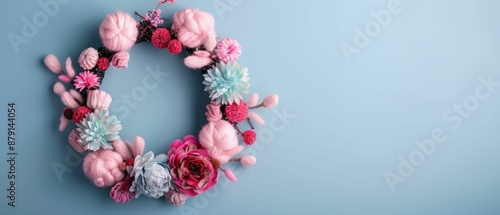 Pink and Blue Floral Wreath on Blue Background.
